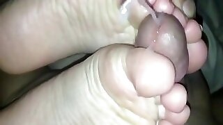 Wife uses her sexy feet to make my cock cum